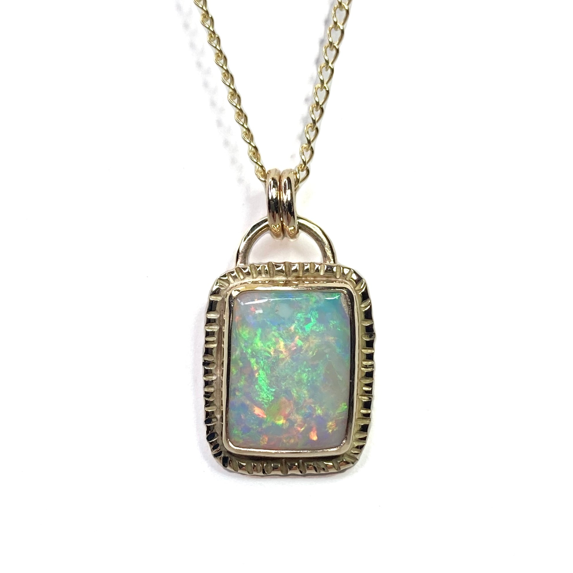 Beautiful Mintabie rainbow opal set in 9ct Gold